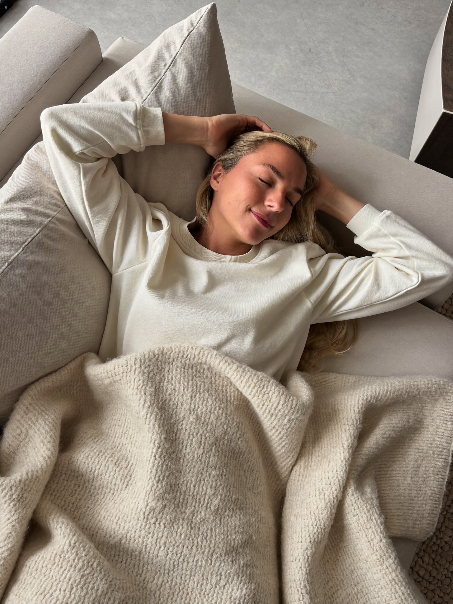 A woman relaxing comfortably at home during recovery