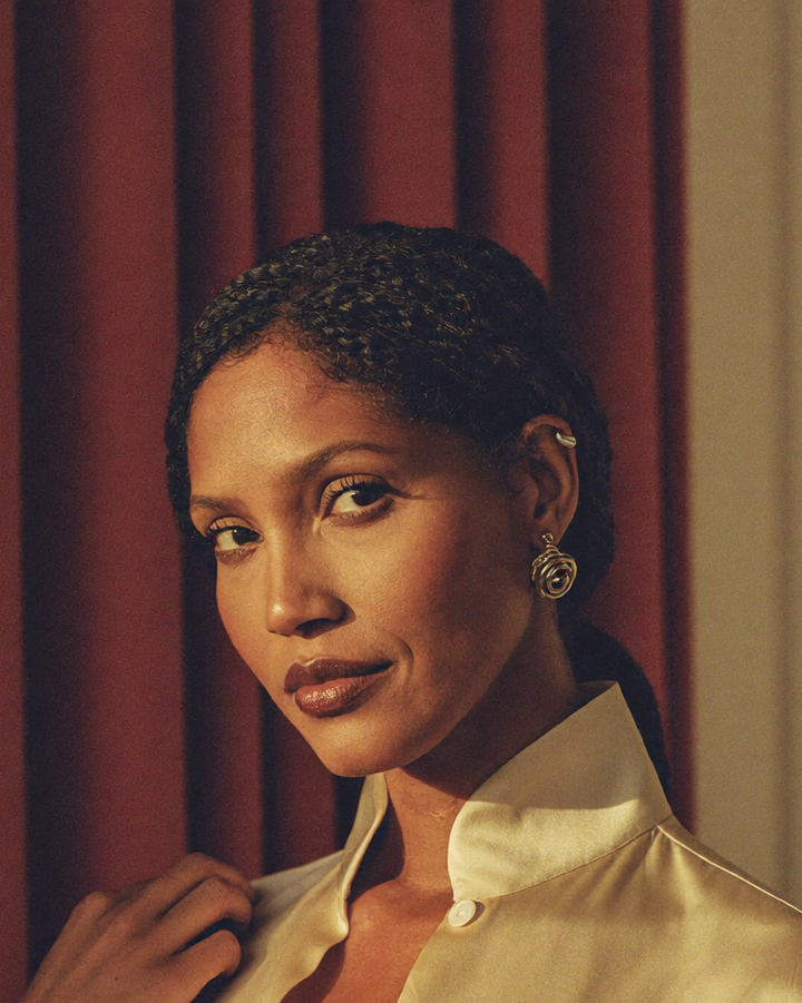 A composed, confident woman restored and at ease in warm natural light