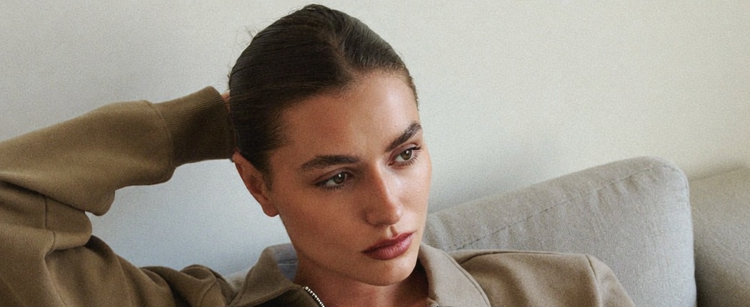 A confident woman at home, calm and in control during an easy recovery